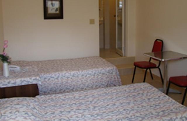 Micro Beach Hotel Garapan Habitación foto